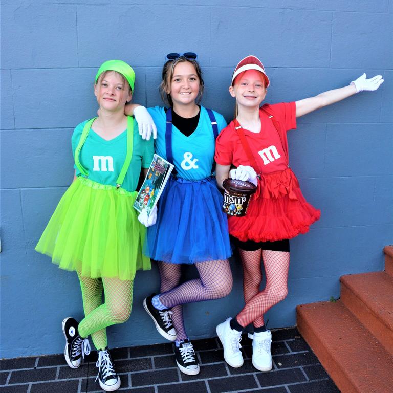 Dressed as chocolate M &amp; M's are (from left) Ellie Sharpe, Bianca Bugg and Freya Doherty. Picture: Rhylea Millar