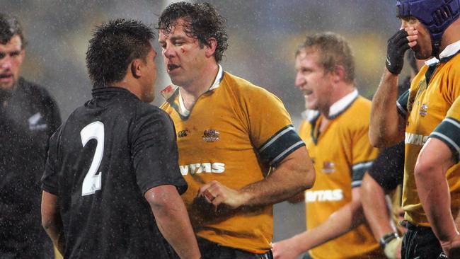 Brendan Cannon of the Wallabies squares off against Keven Mealamu of the All Blacks in 2004.