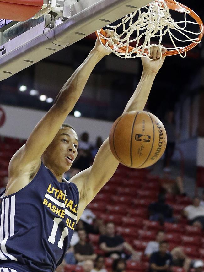 Exum dunks  for the Utah Jazz during the first half of an NBA summer league basketball game against the Denver Nuggets in Las Vegas last week. (AP Photo/Isaac Brekken)