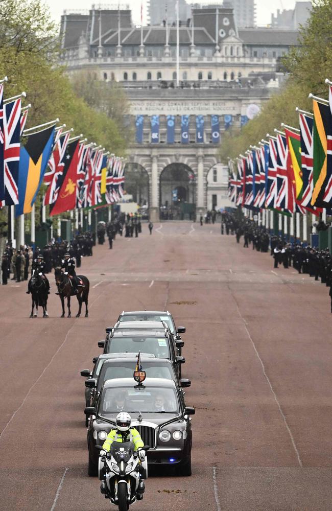 Britain's King Charles III and Britain's Camilla, Queen Consort drive up The Mall to Buckingham Palace at the start of the day. Picture: AFP