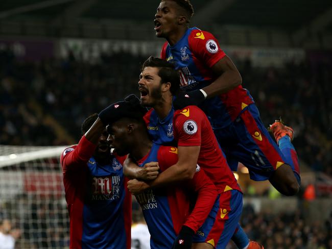 Christian Benteke (2nd L) of Crystal Palace celebrates scoring.