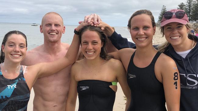 Gold Coast swimmer Maddy Gough (centre) with her TSS Aquatics teammates. Picture: SUPPLIED