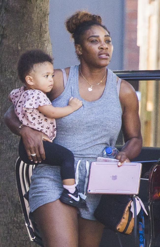 Serena Williams carries daughter Alexia Olympia, 1, during an afternoon walk in Melbourne. Picture: Media Mode