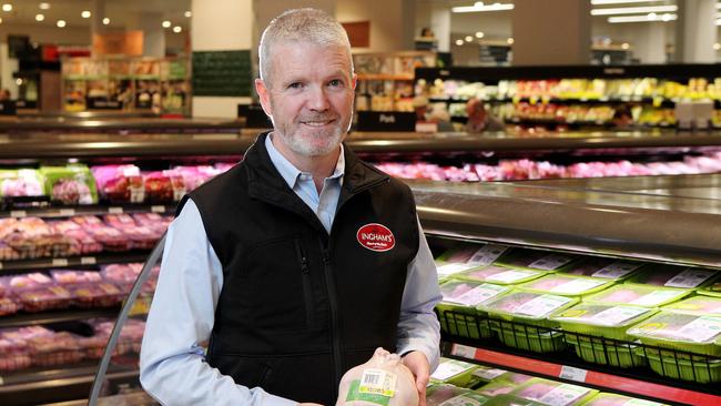 Inghams chief executive Mick McMahon with some of their products in the supermarket aisle at Woolworths. (Hollie Adams/The Australian)