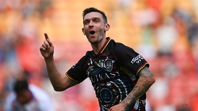 Roar midfielder Jay O'Shea celebrates after scoring a goal at Suncorp Stadium last season. Picture: Albert Perez/Getty Images