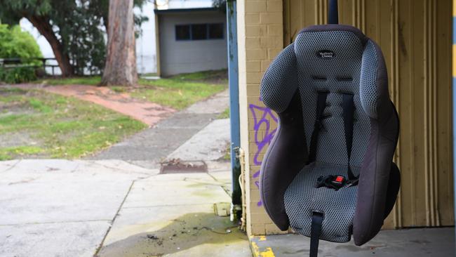 A baby chair hanging outside a locker bay was among the rubbish dumped at Melba College's old campus is seen in Croydon. Picture: James Ross