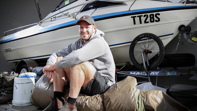 Port Adelaide defender Tom Clurey at home with his boat. Picture: Sarah Reed