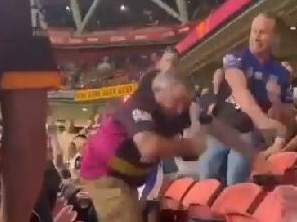 A fight breaks out at Suncorp Stadium last night between a Broncos fan and a Bulldogs fan.