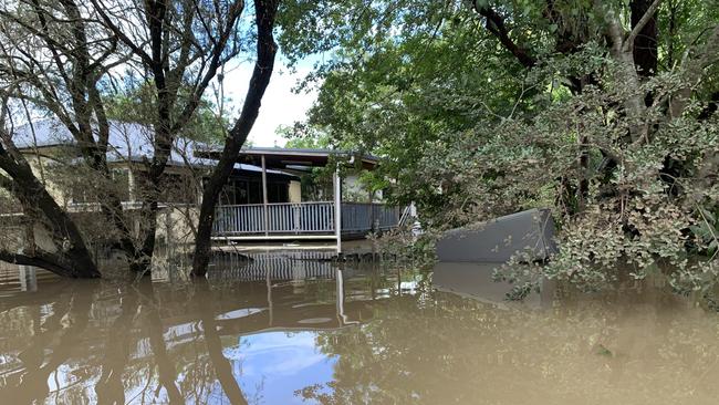A home in Fowler Street is filled with water on March 1, 2022, a day after Lismore was hit by a record flood. Picture: Stuart Cumming