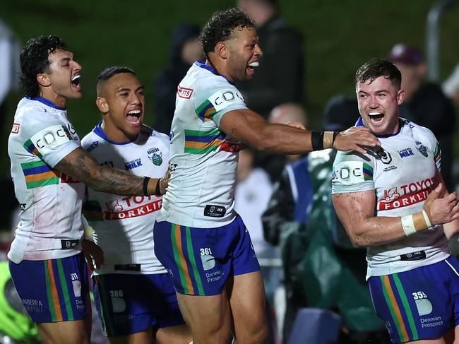 SYDNEY, AUSTRALIA - MAY 03:  Hudson Young of the Raiders celebrates with team mates after scoring a try during the round nine NRL match between Manly Sea Eagles and Canberra Raiders at 4 Pines Park on May 03, 2024, in Sydney, Australia. (Photo by Mark Metcalfe/Getty Images)
