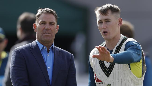 MANCHESTER, ENGLAND - SEPTEMBER 05: Former Australian Cricketer Shane Warne works with Marnus Labuschagne of Australia on his bowling during day two of the 4th Specsavers Test between England and Australia at Old Trafford on September 05, 2019 in Manchester, England.