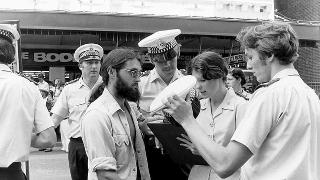 Former Queensland undercover police officer Keith Banks in 1977 processing an arrest during a street march against the Bjelke-Petersen government's anti-march legislation.