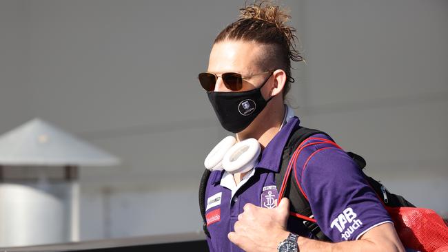 PERTH, AUSTRALIA - JUNE 29: Nat Fyfe of the Dockers looks on while walking to a waiting bus at Cockburn ARC in preparation to make the trip to Melbourne ahead of round 16 of the AFL season, on June 29, 2021 in Perth, Australia. (Photo by Paul Kane/Getty Images)