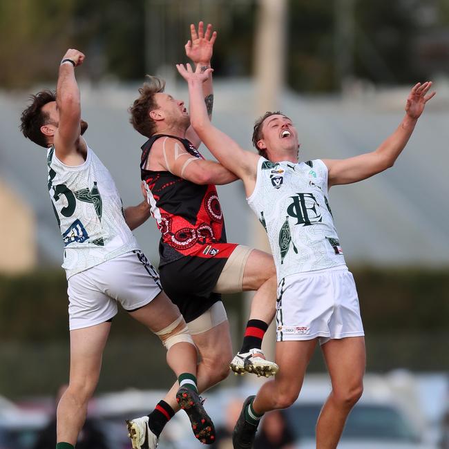 Kayne Pettifer, centre, playing for Kyabram against Echuca this season. Picture: Yuri Kouzmin