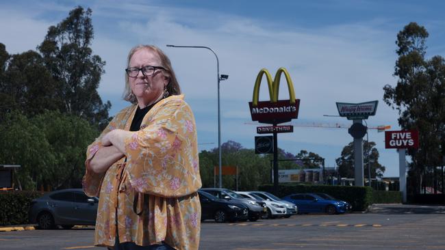 Diabetic Marilyn Alston in front of some of the multitude of fast food outlets in the Penrith LGA which she says triggers her bad eating habits when she sees them driving past. Picture: Jane Dempster