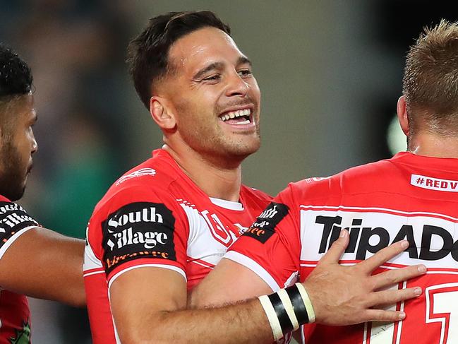 St George's Corey Norman celebrates a try scored by Ben Hunt during the Bulldogs v St George NRL match at ANZ Stadium, Homebush. Picture: Brett Costello