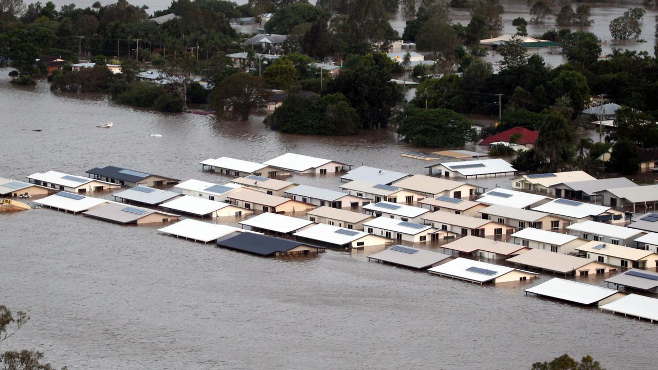 Some of the 3000 homes and businesses inundated by floodwaters in town of Ipswich, west of Brisbane in flood-ravaged Queensland, that has cost at least 15 lives