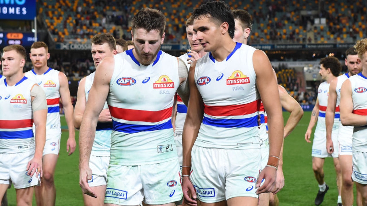 BRISBANE, AUSTRALIA - JUNE 30: Western Bulldogs walk off the field after their defeat during the round 16 AFL match between the Brisbane Lions and the Western Bulldogs at The Gabba on June 30, 2022 in Brisbane, Australia. (Photo by Albert Perez/AFL Photos via Getty Images)