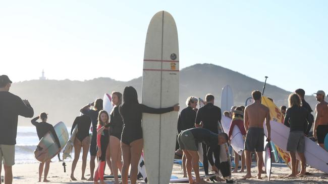 Participants in a paddle-out protest in Byron Bay to oppose the Netflix reality show, Byron Baes. Picture: Liana Boss