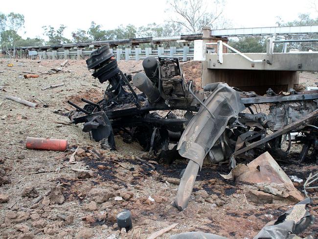 Charred and twisted metal lies near the bridge in the wake of the massive explosion.