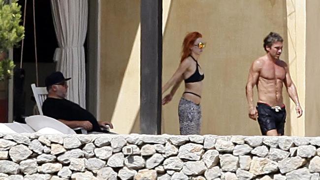 Kyle Sandilands and girlfriend Imogen Anthony enjoy a Spanish villa holiday with friend John Ibrahim.