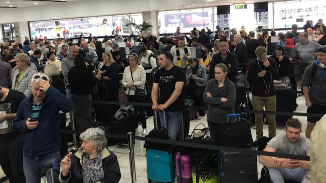 The lengthy queue at Melbourne airport. Picture: Andrew 'Cosi' Costello