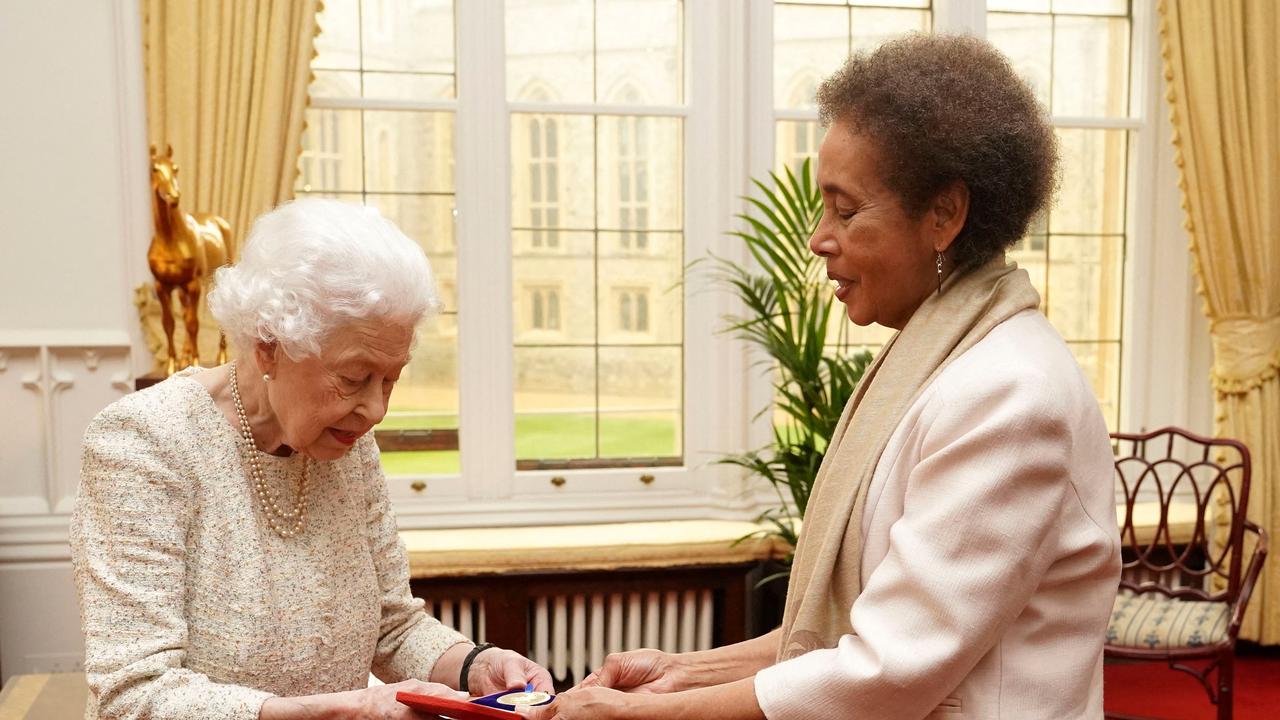 Britain's Queen Elizabeth II presents the Queen's Gold Medal for Poetry during a private audience at Windsor Castle, on March 16. Picture: AFP