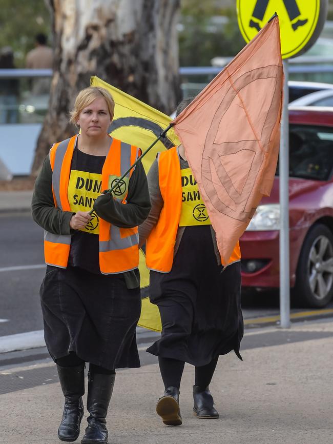 “Dump Santos” was the message out side of the company’s AGM on Thursday. Picture: NCA NewsWire / RoyVphotography