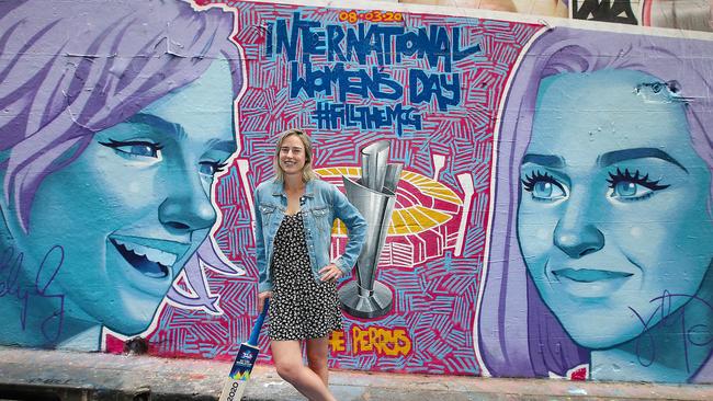 Australian cricketer Ellyse Perry in front of a Katy Perry mural. Picture: Ian Currie