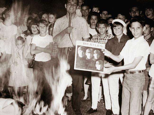 Teenagers gather at a “Beatles Burning” staged by radio WAYX-AM, where records, books, and wigs were burned in a bonfire in response to John Lennon's comment that The Beatles were more popular than Jesus Christ.