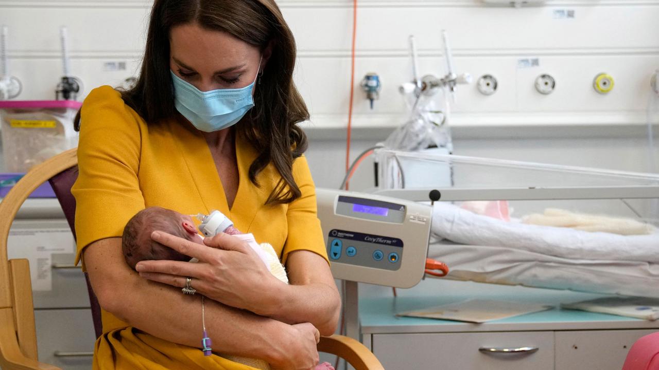 It was even there as she cradled a newborn at the Royal Surrey County Hospital's maternity unit on October 5, 2022. Picture: Alastair Grant/Pool/AFP