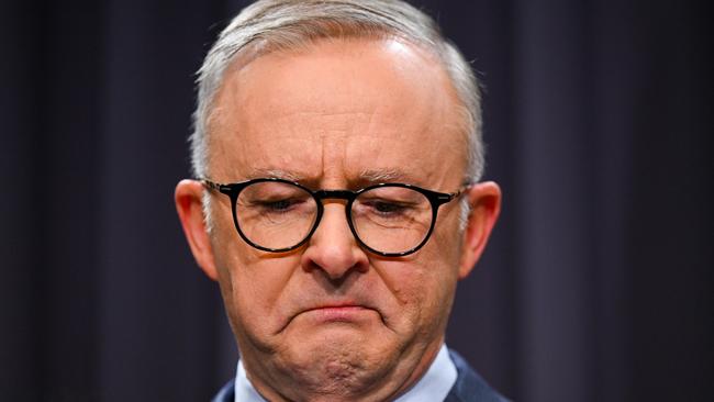 Anthony Albanese surrounded by members of the First Nations Referendum Working Group gets emotional.