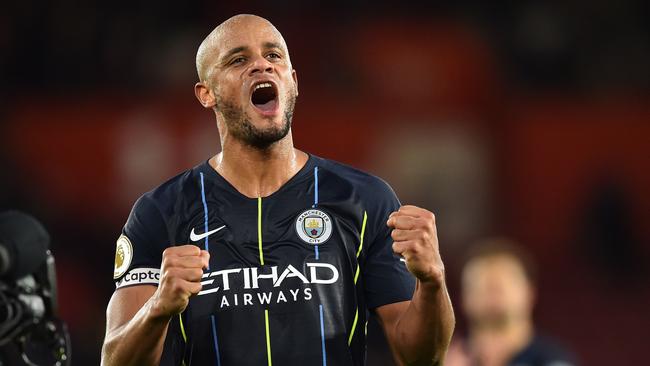 Manchester City's Belgian defender Vincent Kompany celebrates on the pitch after the English Premier League football match between Southampton and Manchester City at St Mary's Stadium in Southampton, southern England on December 30, 2018. - Manchester City won the game 3-1. (Photo by Glyn KIRK / AFP) / RESTRICTED TO EDITORIAL USE. No use with unauthorized audio, video, data, fixture lists, club/league logos or 'live' services. Online in-match use limited to 120 images. An additional 40 images may be used in extra time. No video emulation. Social media in-match use limited to 120 images. An additional 40 images may be used in extra time. No use in betting publications, games or single club/league/player publications. /