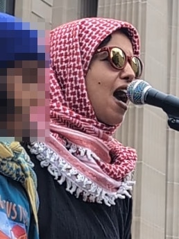 Tasnim Sammak speaking at a protest. Picture: Instagram.