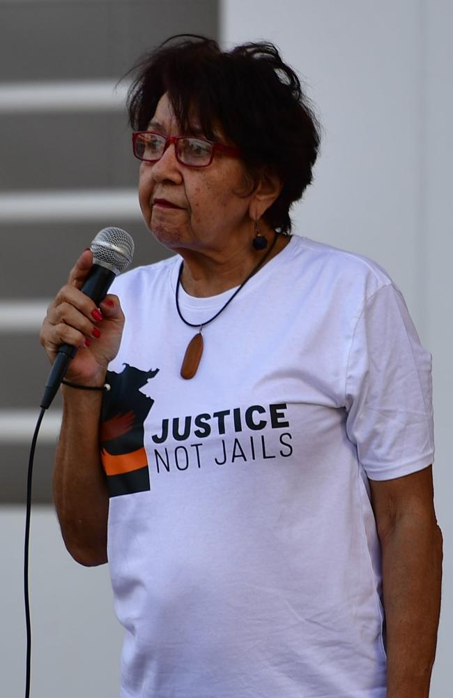 Justice Not Jails member Natalie Hunter speaks outside the NT Parliament on Wednesday during a vigil for Kumanjayi White, a 24-year-old Warlpiri man with a disability who died after being restrained by police in the Alice Springs Coles. Picture: Zizi Averill