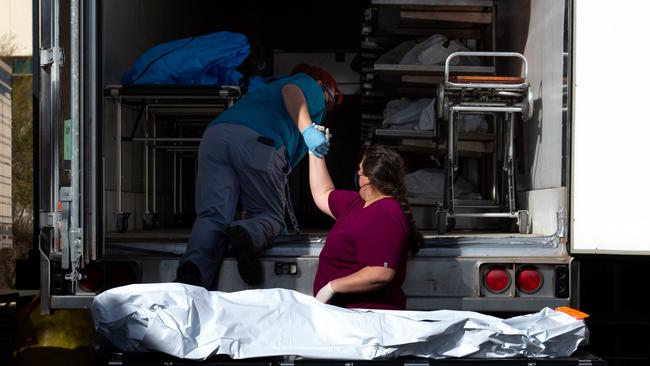 A body about to be loaded into a refrigerated truck at the Pima County Office of the Medical Examiner in Tucson, Arizona, on Thursday. Picture: AFP