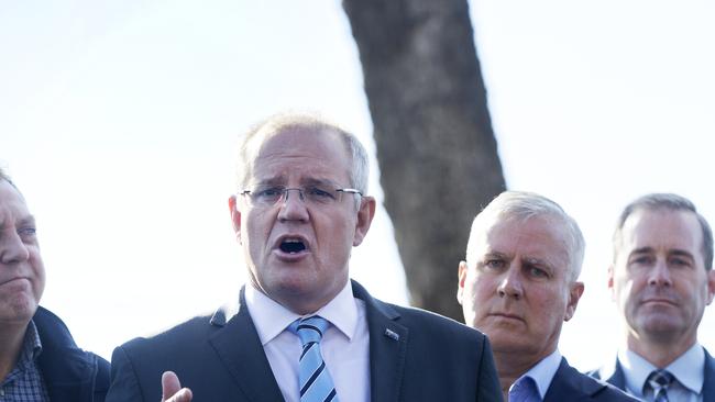 Liberal candidate for Braddon Gavin Pearce, Prime Minister Scott Morrison, Nationals leader Michael McCormack and Tasmanian Health Minister Michael Ferguson in Braddon at Parramatta Creek, Tasmania. PICTURE CHRIS KIDD