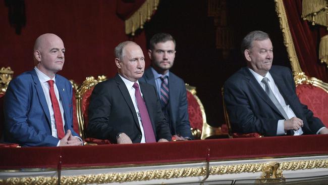 Russian President Vladimir Putin, centre, FIFA President Gianni Infantino, left, and Director of the Bolshoi Theater Vladimir Urin, right, attend the gala-concert dedicated to the closing of FIFA Soccer World Cup at the Bolshoi Theater in Moscow.