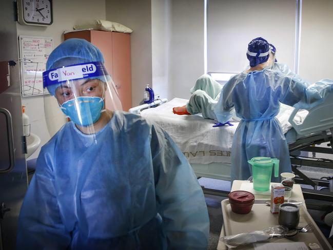 Behind the Scenes at the Royal Melbourne Hospital ICU and COVID wards. Nurses care for patient on COVID Ward 9 West.  Picture: David Caird