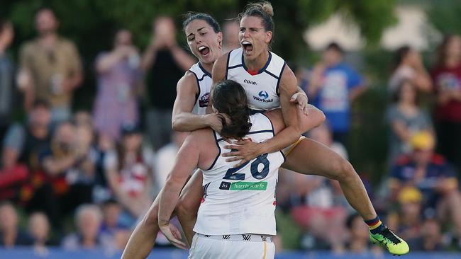 Sarah Perkins is mobbed by Chelsea Randall and Angela Foley. Picture: Wayne Ludbey