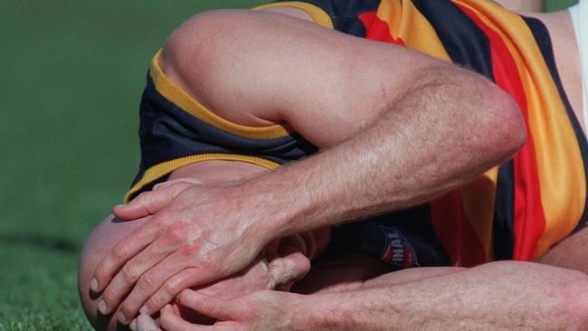 Smart after being knocked to the ground during the 1998 grand final.