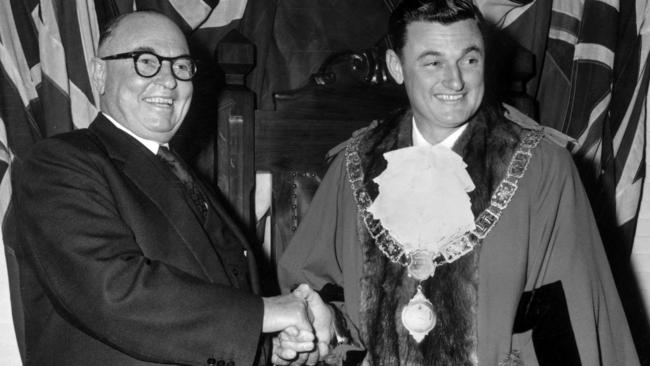 SA politician John Elden McLeay (r) being congratulated by his father Sir John McLeay (l) on becoming Mayor of Unley in 1961.