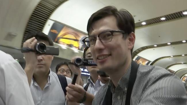 Safe: Australian student Alex Sigley smiles as he arrives at the airport in Beijing today after being released from detention in North Korea. Picture: Emily Wang/AP