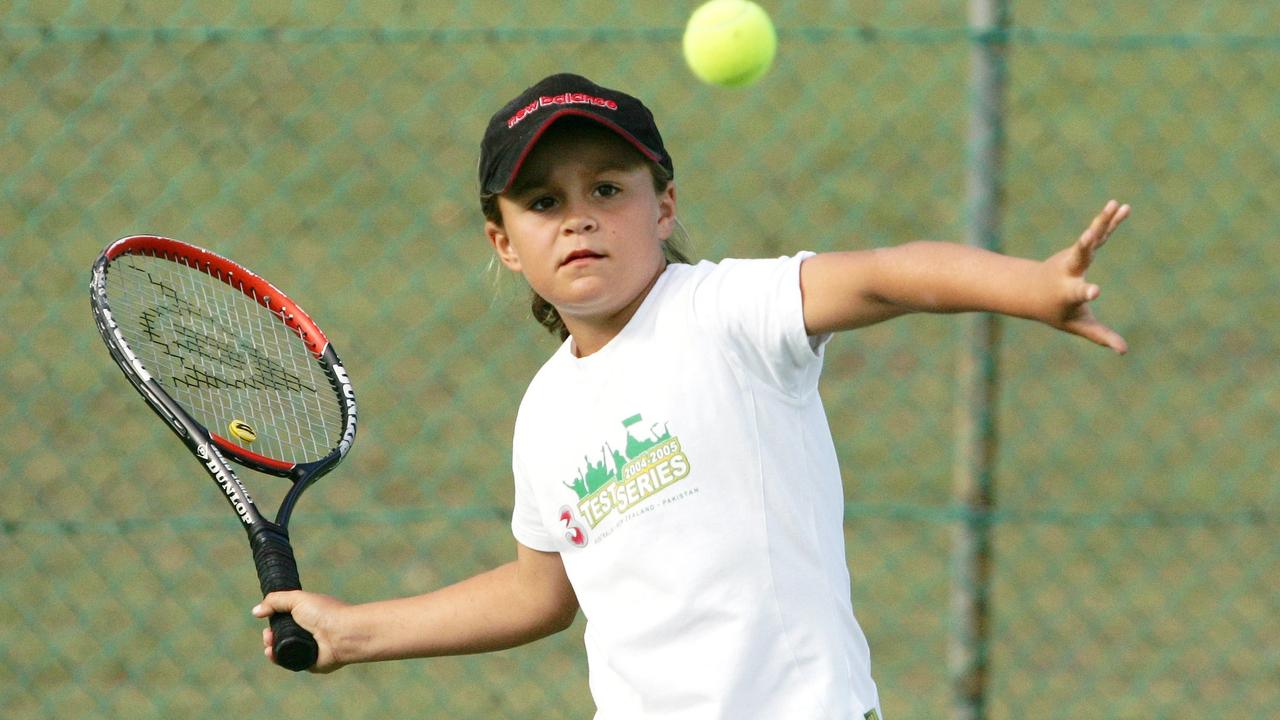 Ash Barty playing tennis as an eight-year-old.