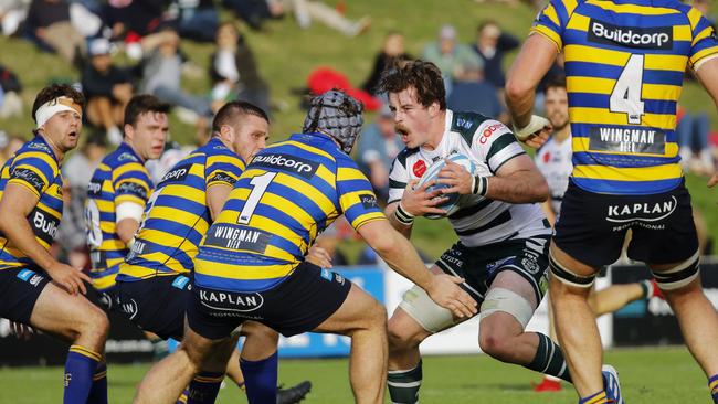 Sydney University in action against last year’s grand finalists Warringah in round one. Pic: Karen Watson.