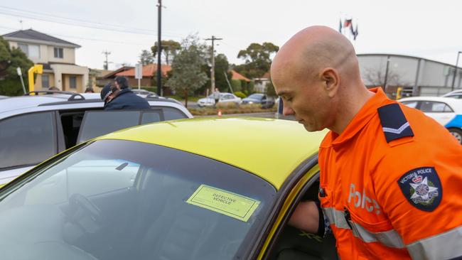 Dozens of drivers were asked to surrender their vehicles at Altona police station. Picture: Brendan Beckett