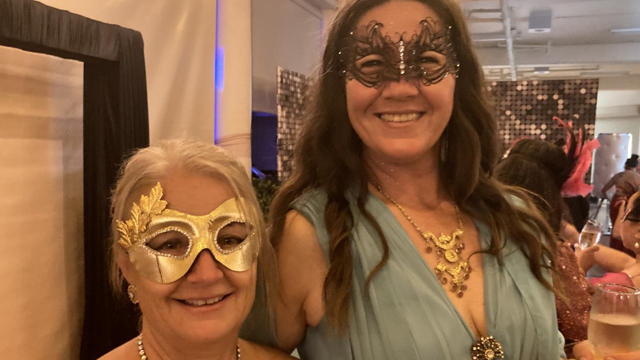 Jenece Drake and Tanja Gahler celebrate at the Gympie RSL Masked Ball, April 29 2023.