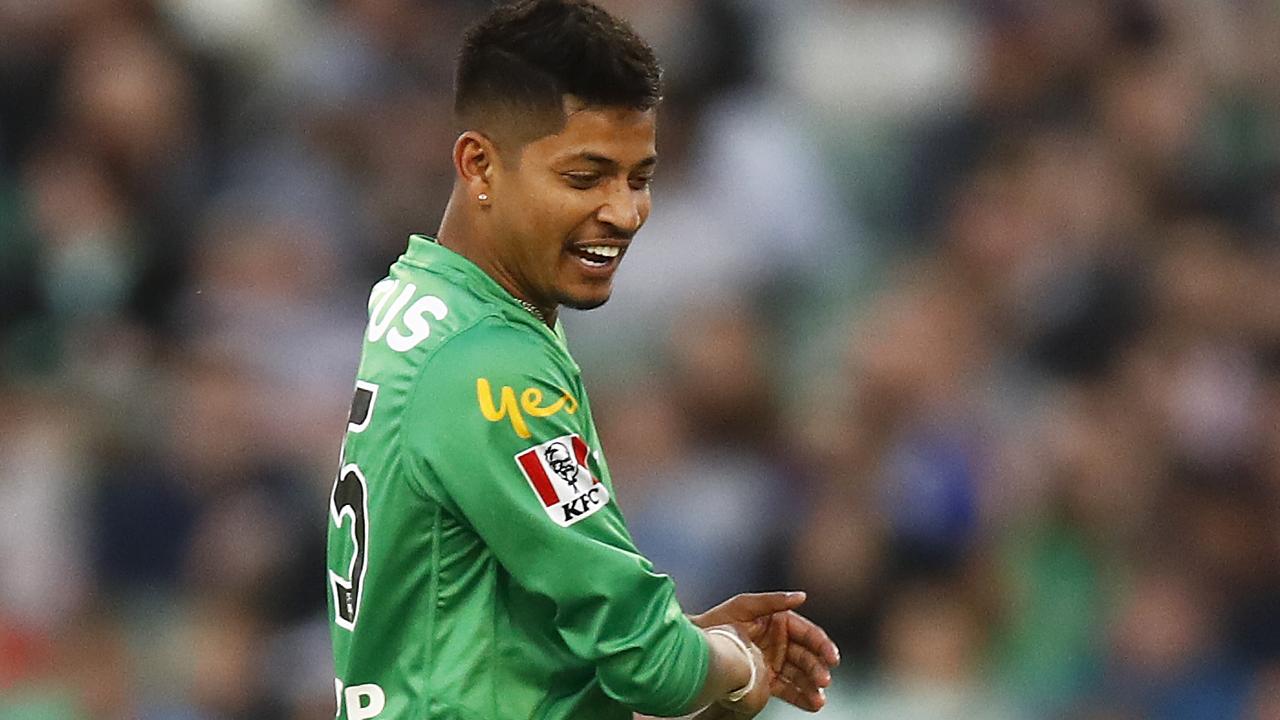 A smiling Sandeep Lamichhane enjoys the wicket of Tom Cooper during Melbourne Stars victory over Melbourne Renegades.