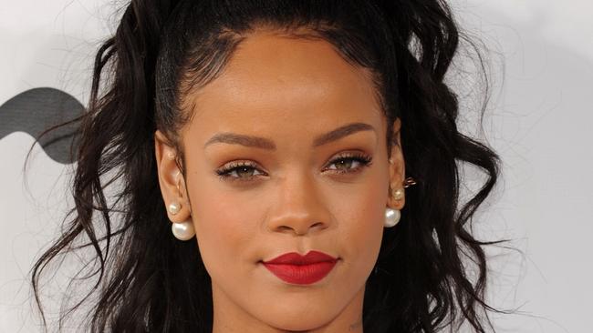 Rihanna rocking red lipstick at the Christian Dior Cruise show Photo: Bryan Bedder/Getty Images for Christian Dior