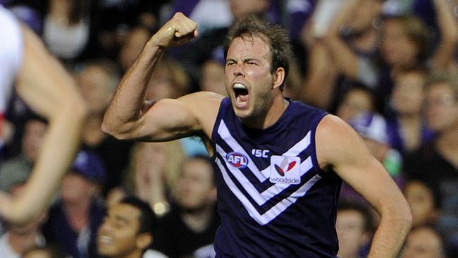 AFL - Fremantle Dockers vs Western Bulldogs in the ANZAC Day clash at Patersons Stadium, Perth. PICTURED - Docker Kepler Bradley celebrates an important goal in the second quarter, watched by Bulldog Lindsay Gilbee.